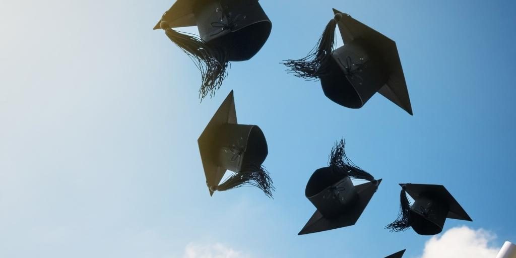 Graduation Caps in Sky